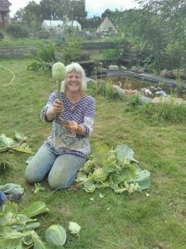 Judy proudly displaying a cabbage head